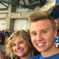 Two people smiling at the football game